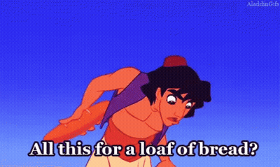 A Cartoon Character From Aladdin Is Holding A Loaf Of Bread . GIF