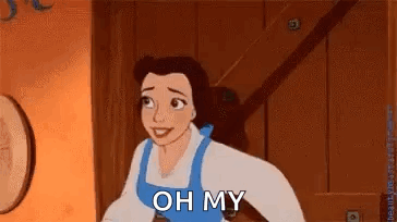 A Cartoon Character From Beauty And The Beast Is Standing In A Room And Smiling . GIF