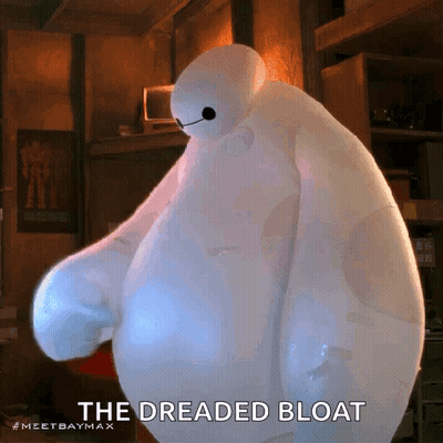 A Cartoon Character From Big Hero 6 Is Standing In A Room With The Words The Dreaded Bloat Below Him . GIF