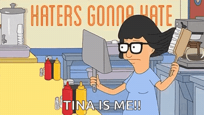 A Cartoon Character From Bob 'S Burgers Is Holding A Brush And A Laptop Computer In A Kitchen . GIF