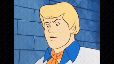 A Cartoon Character From Scooby Doo Is Making A Funny Face . GIF