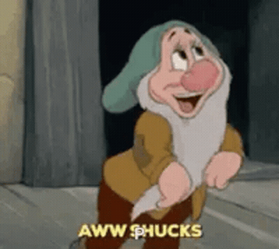 A Cartoon Character From Snow White And The Seven Dwarfs Is Standing In Front Of A Wall And Laughing . GIF