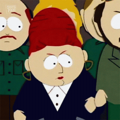 A Cartoon Character From South Park Is Standing In A Crowd Of People And Making A Funny Face . GIF