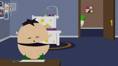 A Cartoon Character From South Park Sits At A Table GIF