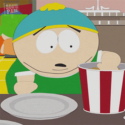 A Cartoon Character From South Park Sits At A Table With A Plate And A Bucket Of Kfc GIF