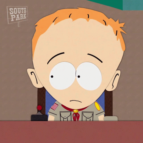 A Cartoon Character From South Park Sits In Front Of A Sign That Says South Park GIF