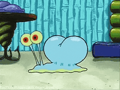 A Cartoon Character From Spongebob Squarepants Is Crawling On The Sand GIF