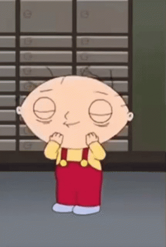 A Cartoon Character From The Family Guy Is Standing In Front Of A Row Of Boxes . GIF