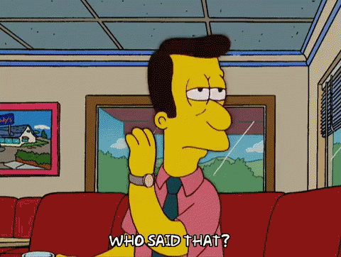 A Cartoon Character From The Simpsons Is Sitting On A Couch And Saying " Who Said That " GIF