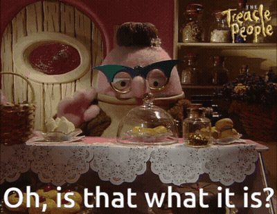 A Cartoon Character From The Treacle People Is Standing At A Table GIF