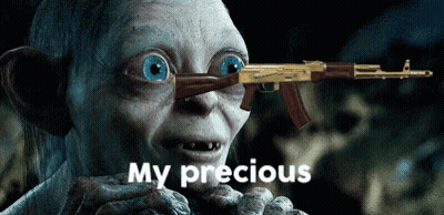 A Cartoon Character Holding A Gun With The Words My Precious Below Him GIF