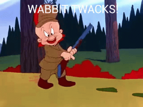 A Cartoon Character Holding A Gun With The Words Wabbit Twacks Written Below Him GIF