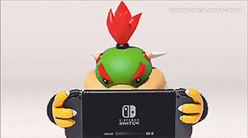 A Cartoon Character Holding A Nintendo Switch In His Hands GIF