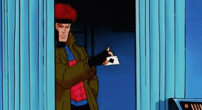 A Cartoon Character Holding A Playing Card In His Hand . GIF