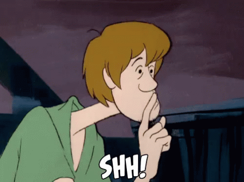 A Cartoon Character Holds His Finger To His Mouth And Says " Shh " GIF