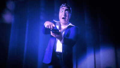 A Cartoon Character In A Blue Suit Is Holding A Cell Phone GIF