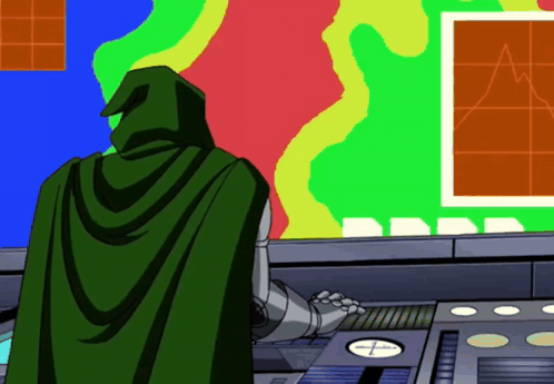 A Cartoon Character In A Green Cape Stands In Front Of A Colorful Wall GIF