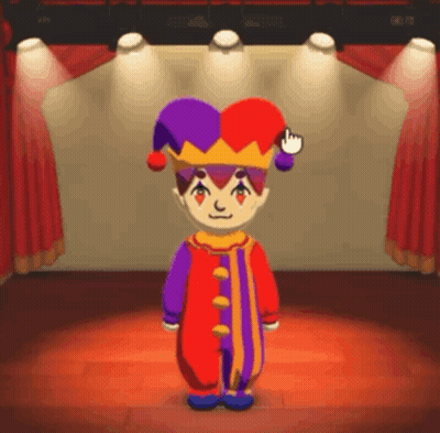 A Cartoon Character In A Jester Costume Is Standing On A Stage In Front Of A Red Curtain . GIF