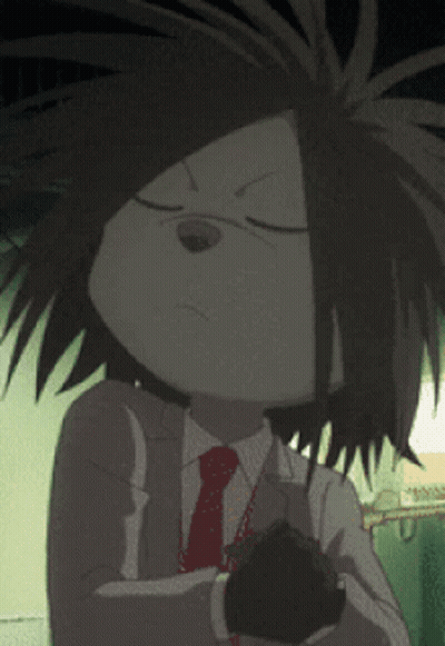 A Cartoon Character In A Suit And Tie Holds A Black Object GIF