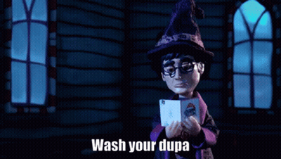 A Cartoon Character In A Witch Hat Is Holding A Card And Says `` Wash Your Dupa '' . GIF