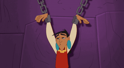 A Cartoon Character Is Chained To A Wall GIF
