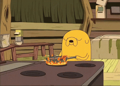 A Cartoon Character Is Cooking On A Stove With Flames Coming Out Of It GIF