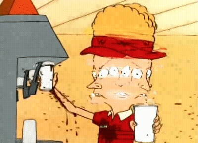 A Cartoon Character Is Drinking A Milkshake From A Machine While Wearing A Hat . GIF