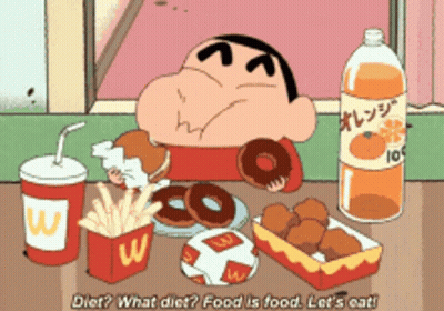A Cartoon Character Is Eating A Hamburger And French Fries While A Bottle Of Orange Juice Sits On A Table GIF