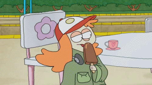 A Cartoon Character Is Eating An Ice Cream Bar While Sitting On A Bench GIF