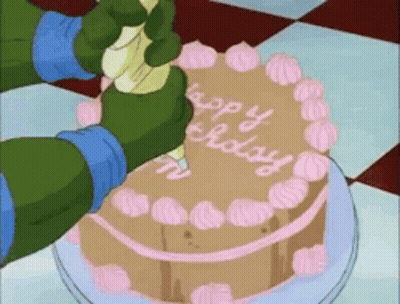 A Cartoon Character Is Frosting A Cake That Says Happy Birthday On It GIF
