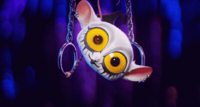 A Cartoon Character Is Hanging Upside Down With Rings Around Its Neck GIF