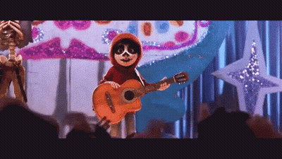 A Cartoon Character Is Holding A Guitar On A Stage . GIF