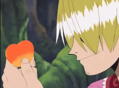 A Cartoon Character Is Holding A Heart In His Hand And Smelling It . GIF