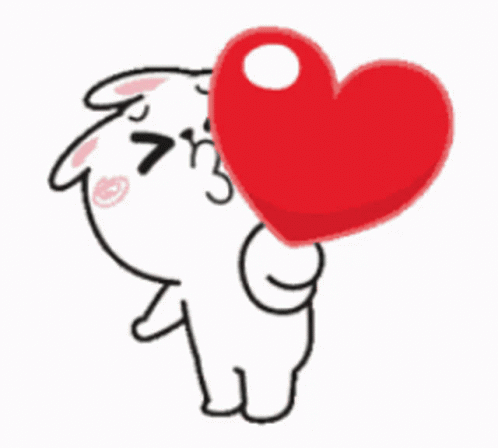 A Cartoon Character Is Holding A Large Red Heart In His Mouth . GIF