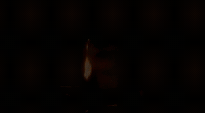 A Cartoon Character Is Holding A Lighter In Her Hand And Lighting A Cigarette . GIF