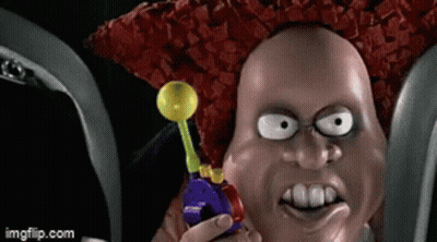 A Cartoon Character Is Holding A Lollipop In His Hand GIF