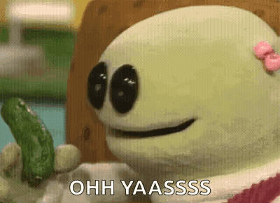 A Cartoon Character Is Holding A Pickle And Says Ohh Yaasssss . GIF