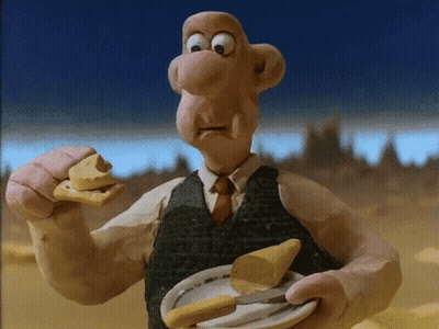 A Cartoon Character Is Holding A Plate Of Food And Eating A Piece Of Cheese GIF