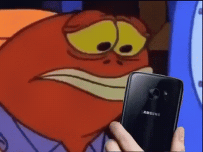 A Cartoon Character Is Holding A Samsung Phone In Front Of Him . GIF