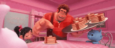 A Cartoon Character Is Holding A Tray Of Pancakes And Pointing At Them GIF