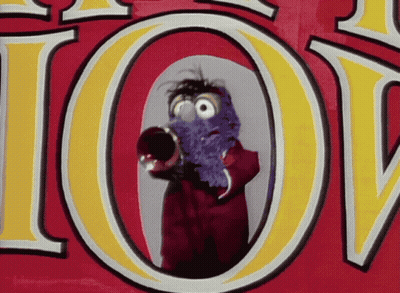 A Cartoon Character Is Holding A Trumpet In Front Of A Sign That Says Joy GIF