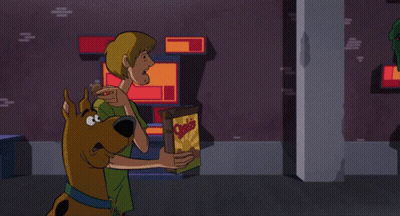 A Cartoon Character Is Holding Something In His Hand And Screaming GIF