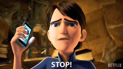 A Cartoon Character Is Holding Up A Cell Phone And Says " Stop " GIF