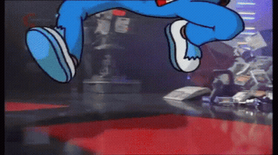 A Cartoon Character Is Jumping In The Air While Wearing Blue Jeans GIF