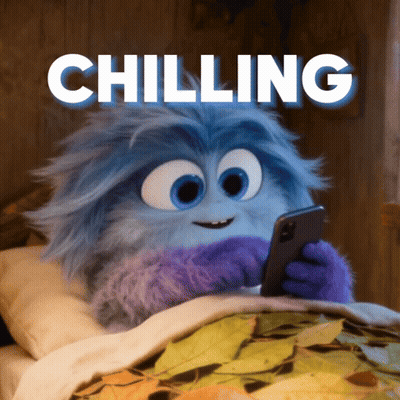 A Cartoon Character Is Laying In Bed Looking At A Cell Phone With The Words Chilling Above Him GIF