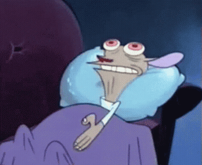 A Cartoon Character Is Laying In Bed With A Blue Pillow GIF