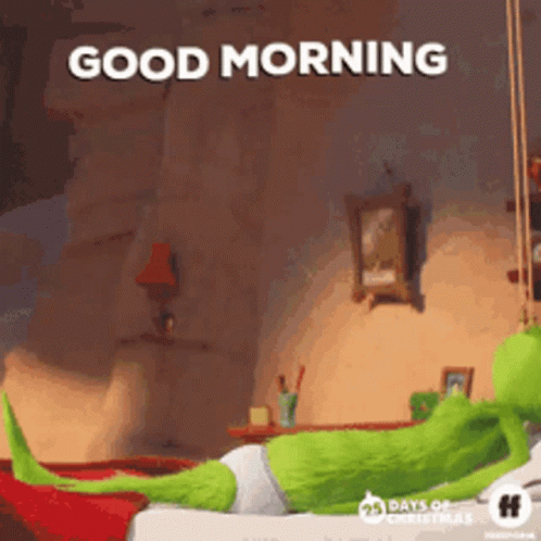 A Cartoon Character Is Laying On A Bed With The Words `` Good Morning '' Written Above Him . GIF