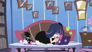 A Cartoon Character Is Laying On A Couch With A Laptop GIF