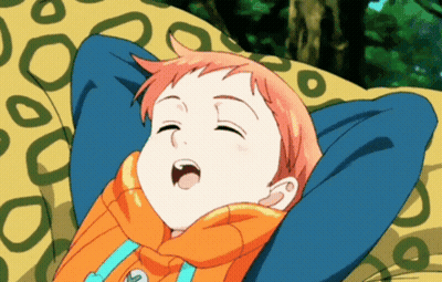 A Cartoon Character Is Laying On A Yellow Blanket With His Eyes Closed GIF