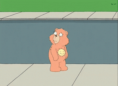A Cartoon Character Is Laying On The Ground On The Sidewalk . GIF